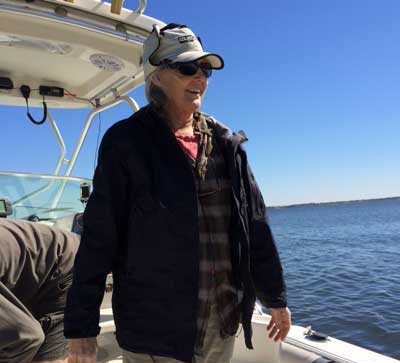 Sally Epply standing on a boat on Tampa Bay
