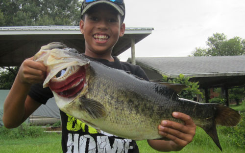 Boy holding lunker bass