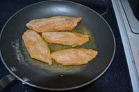 fry breaded fish in oil Breaded fish in frying pan
