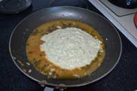 remove fish from pan, add alfredo sauce and mix Add the alfredo sauce to the picatta