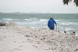 Person searching for treasures on a beach