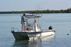 Man on boat with fishing pole