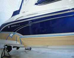 Formula boat being painted blue