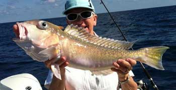 Man holding golden tilefish