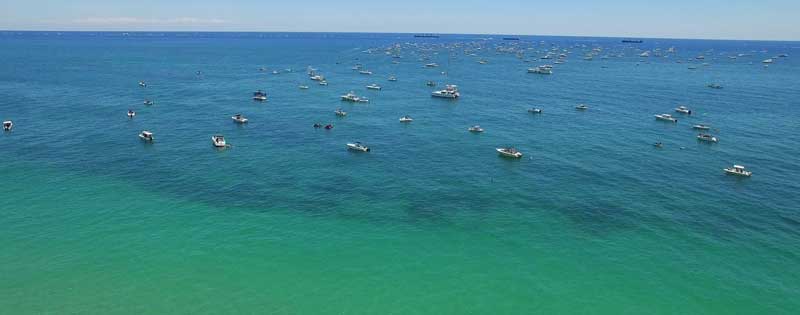 off shore reef with a lot of boats fishing
