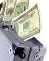 grey metal suitcase with 100 dollar bills coming out