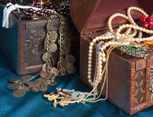 Treasure check full of jewels and coins