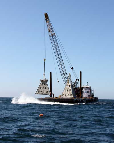 super reef module being lowered into water