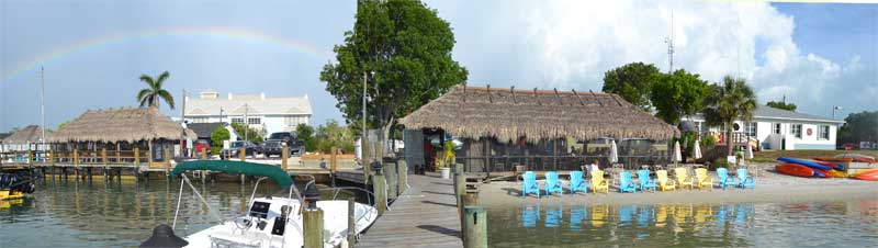 water view of the restaurants and fire station on isles of capri with rainbow overhead