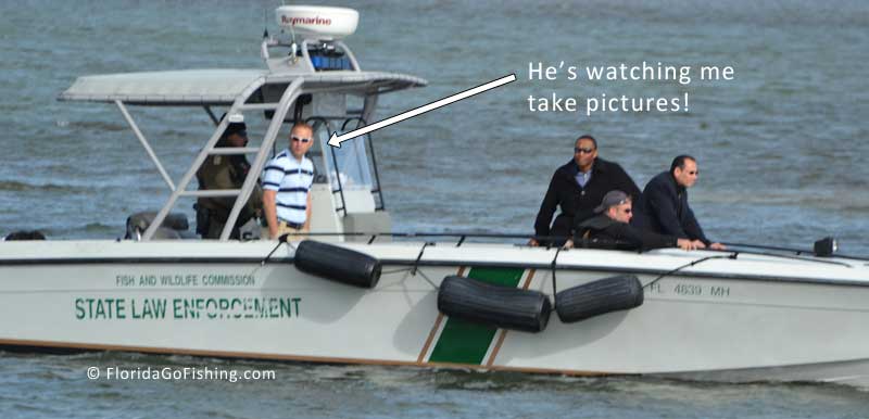collier county sherrif boat with officers watching the VP and one guy watching me take pictures!