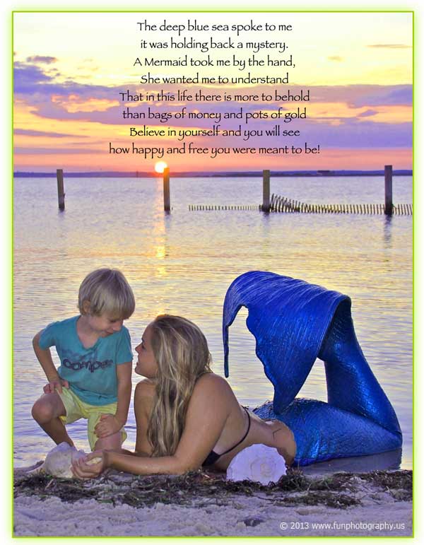 miss mermaid laying on the sand at the edge of the beach with a little boy and the sun setting, pink sky