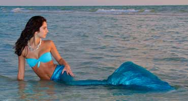Miss Mermaid in the water in a very seductive pose