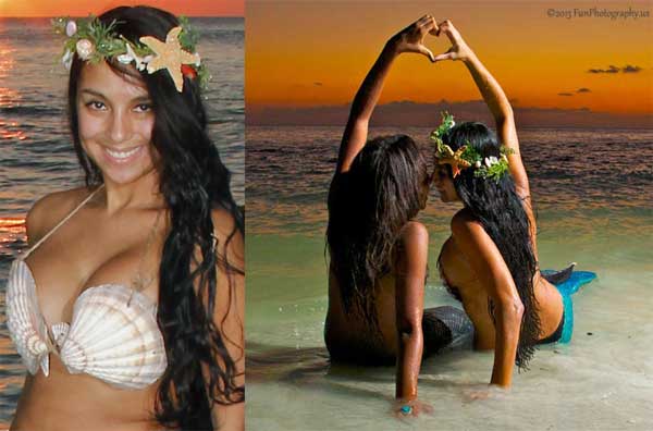 two mermaids playing in the sand