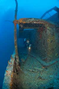 Scuba diver inside wreck