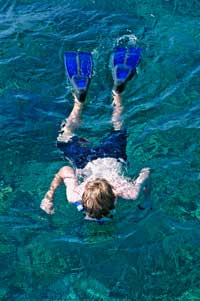 boy in the water snorkeling